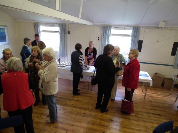A group of people at the book launch chatting