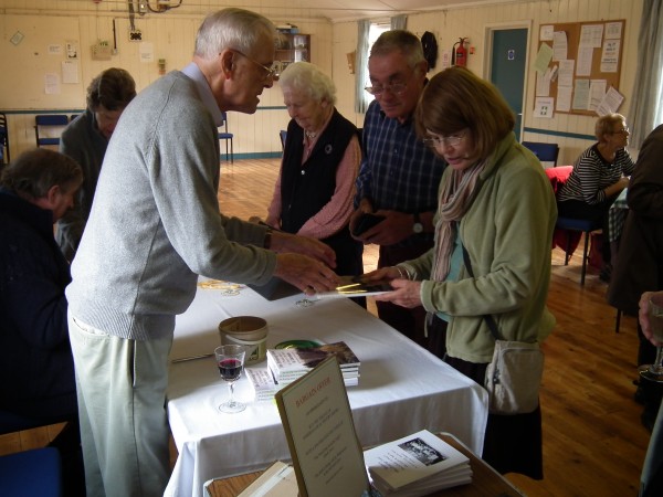 The author chatting to people at the book launch