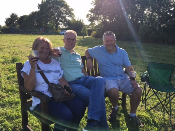 3 people sitting down